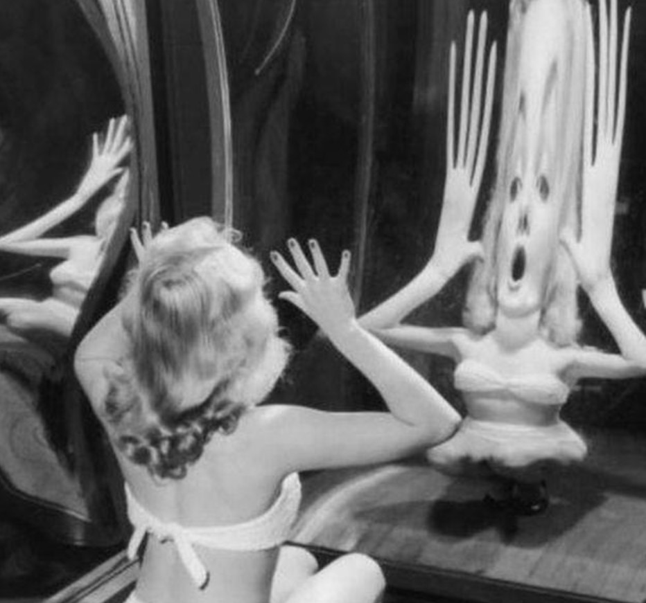 Marilyn Monroe Looking Into A Funhouse Mirror C. 1950s.