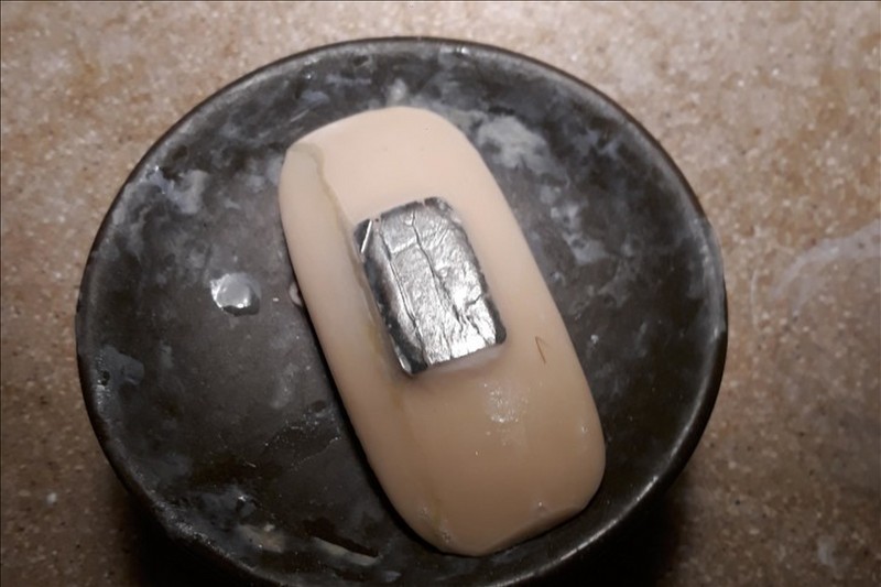 Soap With Aluminum Foil On The Back