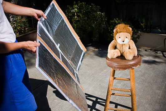 Person Holding Aluminum Foil Reflector