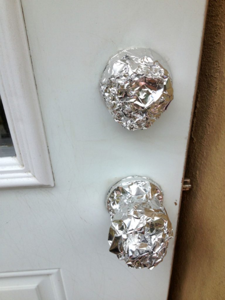 Doorknob And Deadbolt Covered In Foil